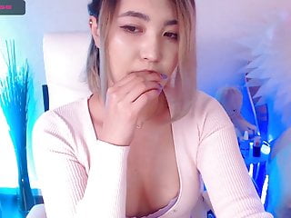 Adorable Asian younger woman, webcam type