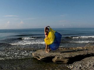 Dancing on Mediterranian Sea Seaside with Yellow-Blue Scarf