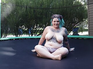 Fats Tattooed Milf Leaping and Stripping on a Trampoline