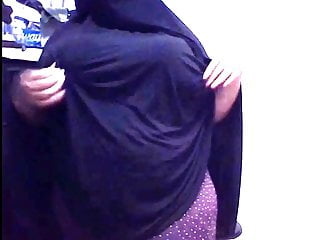 Arab woman with a large ass dressed in a Niqab displays giant boobs